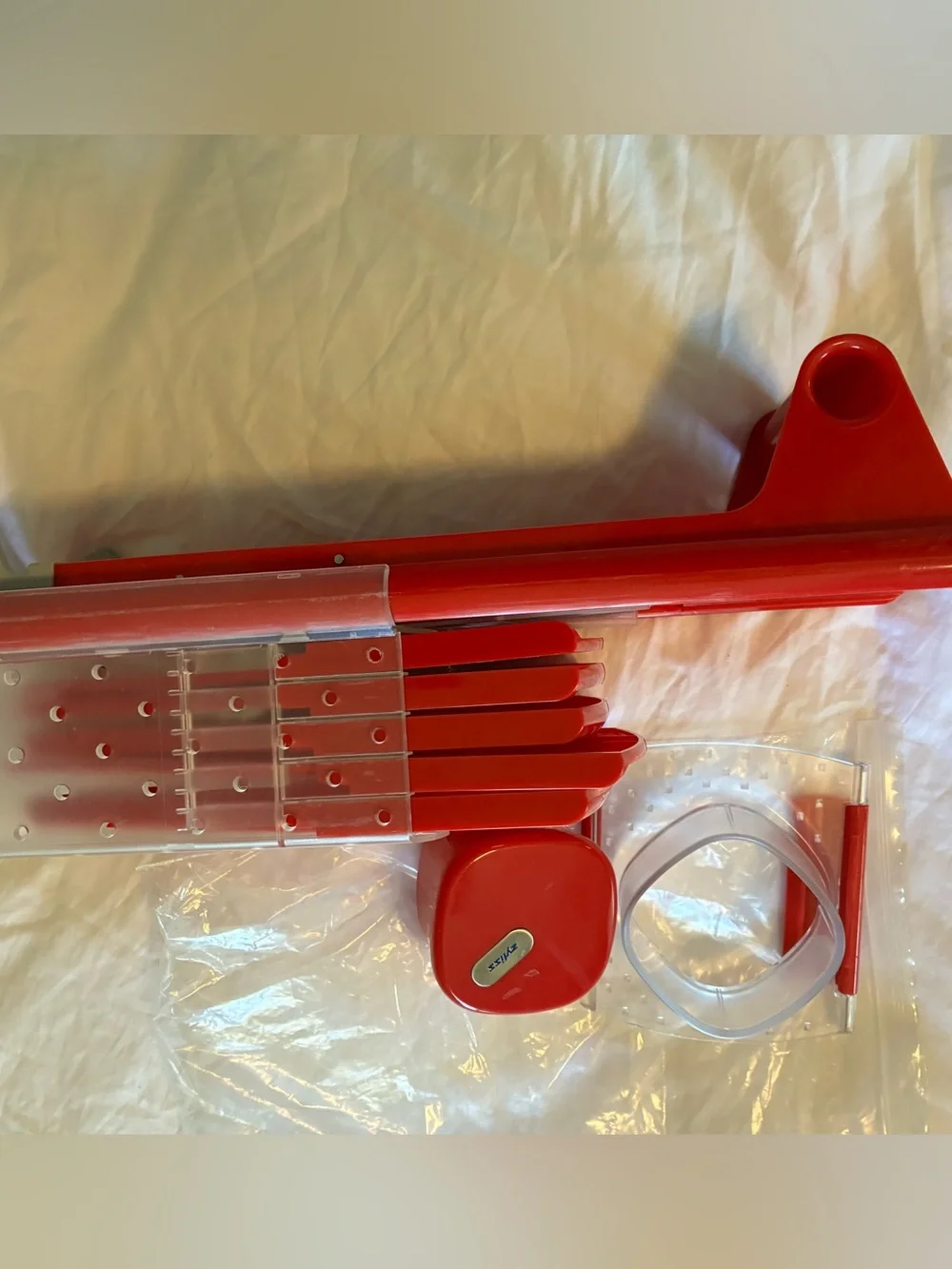Red Stackable multi-piece mandoline.